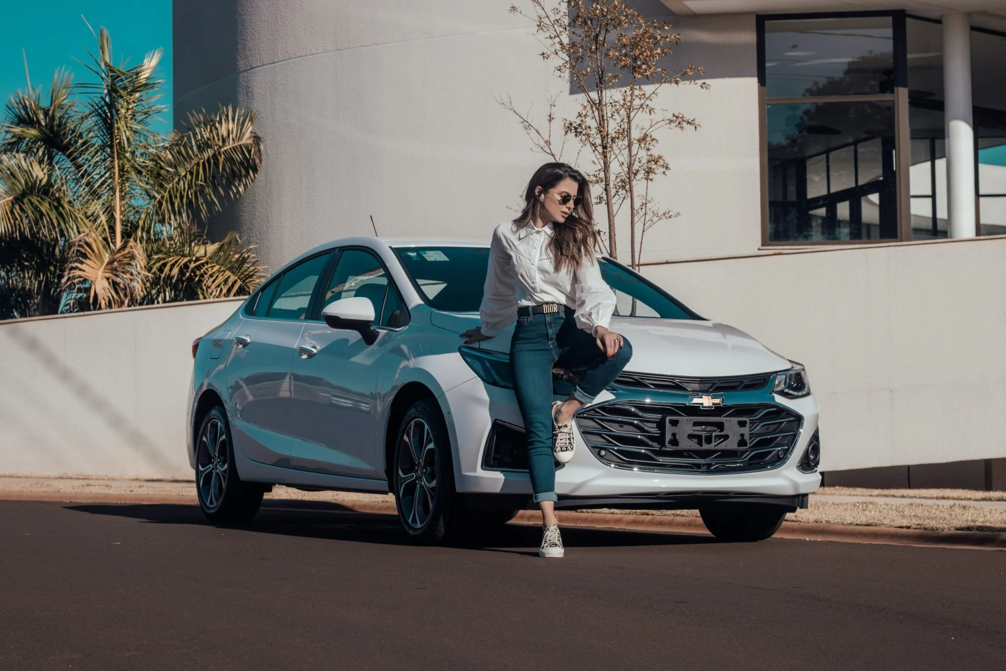 raphael-lovaski-GIGXTbZ_VPY-unsplash-scaled-2048x1366 lady leaning to her white sedan